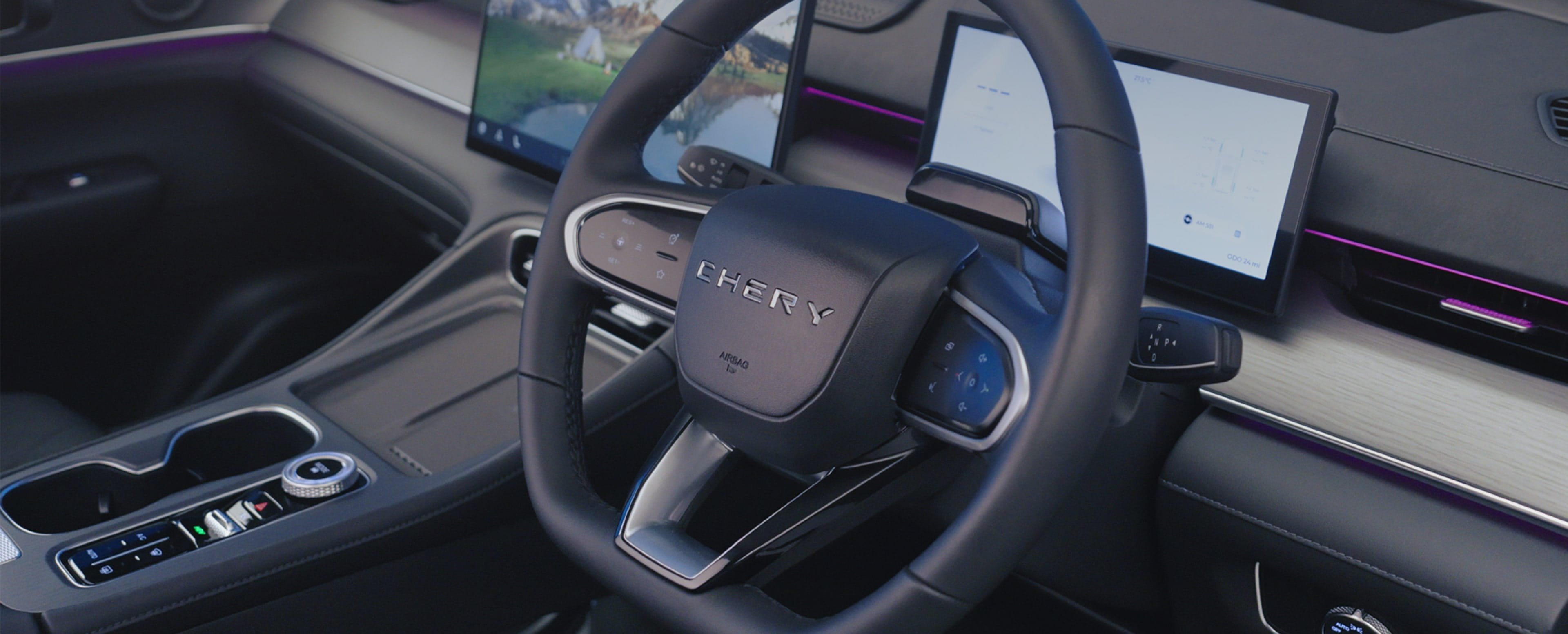 Car interior showing a steering wheel, digital display, and centre console.