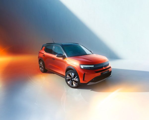 Orange SUV car with black details, viewed from a three-quarter front angle.