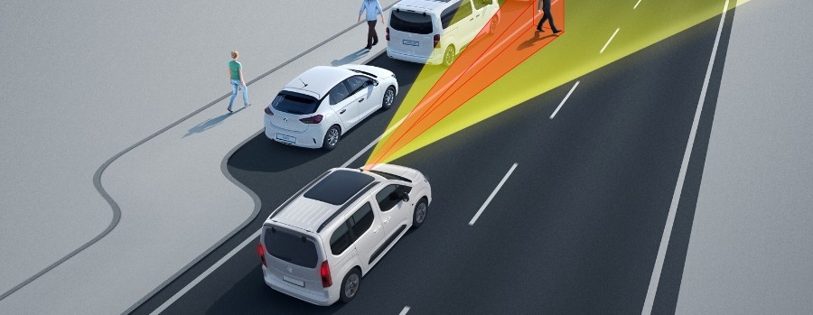 Car using sensors to detect nearby pedestrians and vehicles on a road.