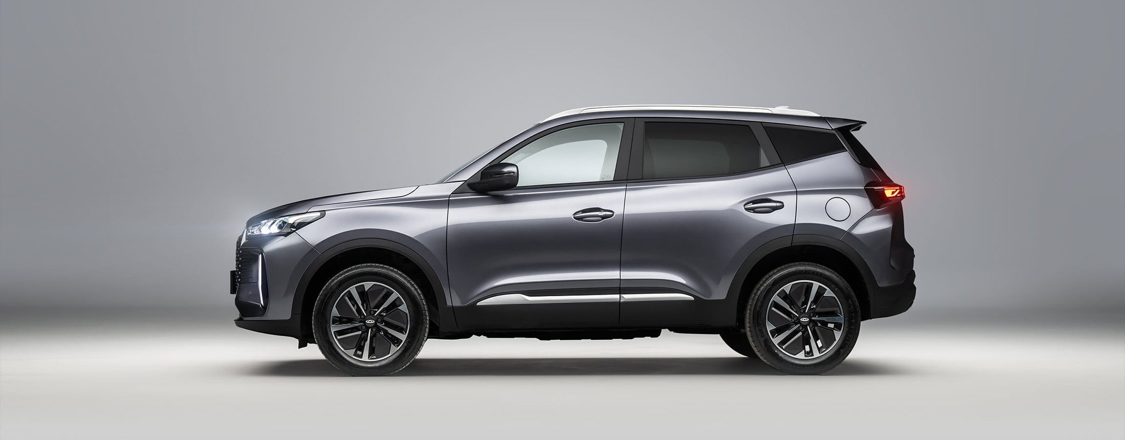 Silver SUV shown from the side.